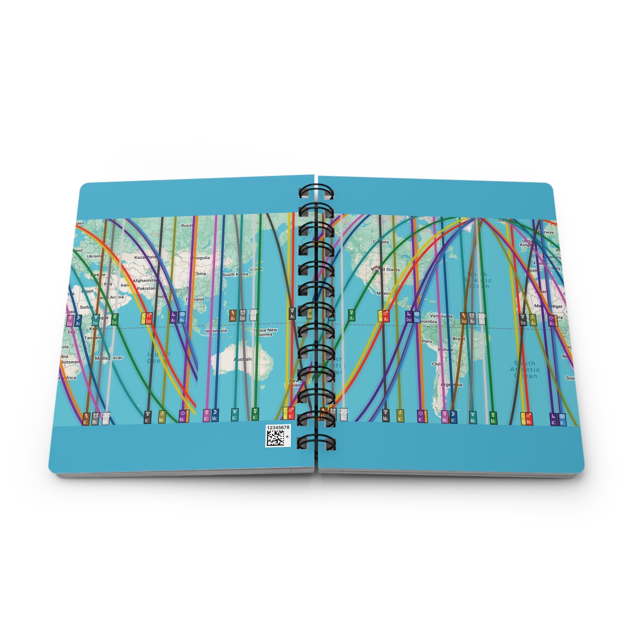 Open notebook with colorful personalized astrocartography map design on a blue background