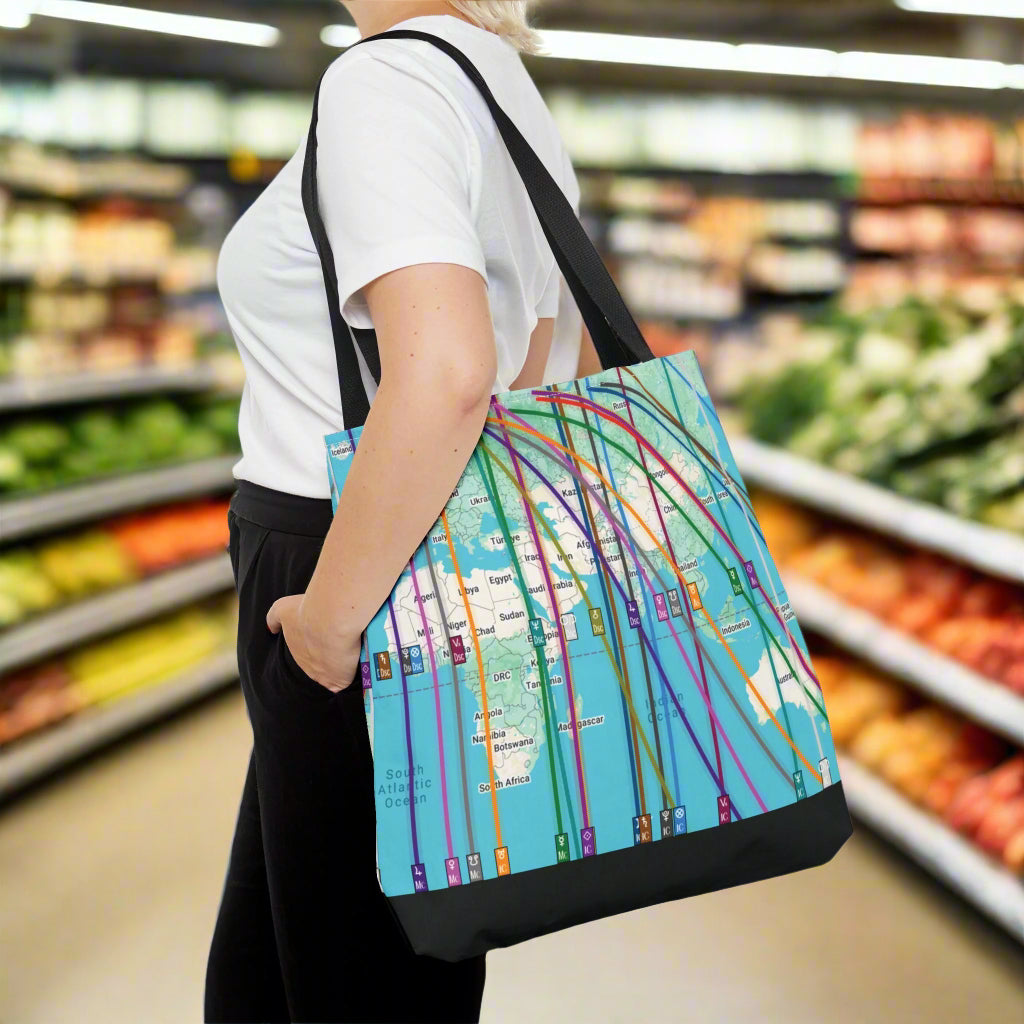 woman with colorful personalized astrocartography world map tote bag on shoulder in a grocery store