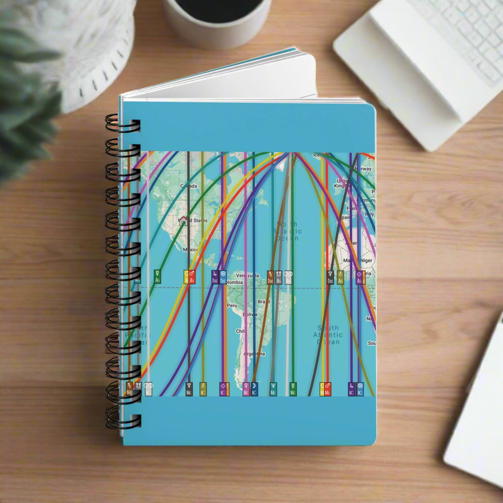 Notebook with a personalized astrocartography world map design on a blue background