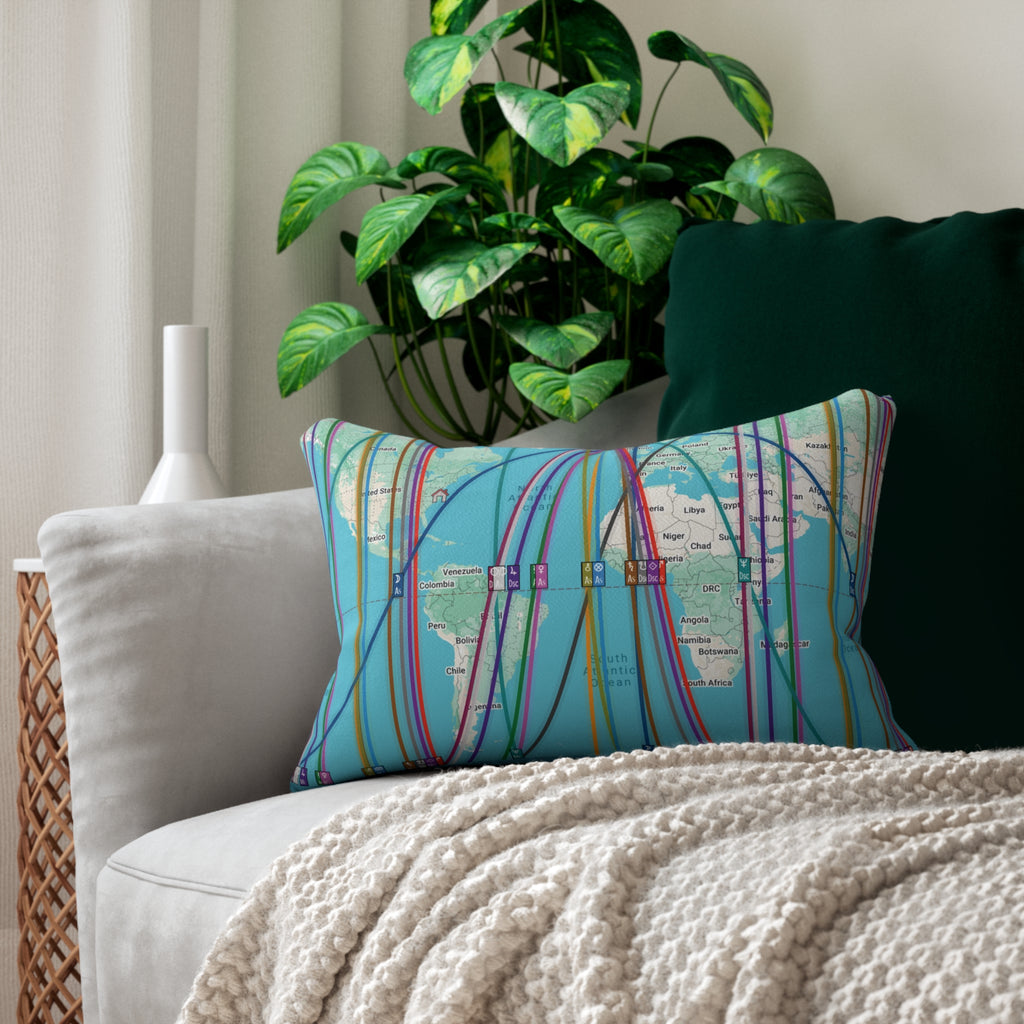 Decorative personalized astrocartography map throw pillow on a couch with a plant in the background